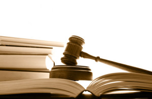 judges court gavel on law books, over white